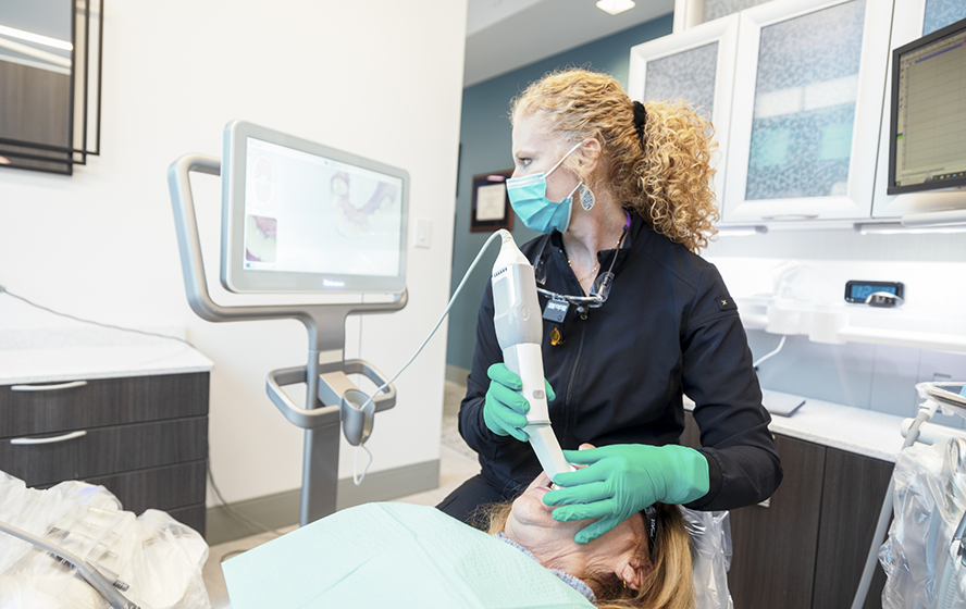 Dentist capturing bite impressions using digital impression system