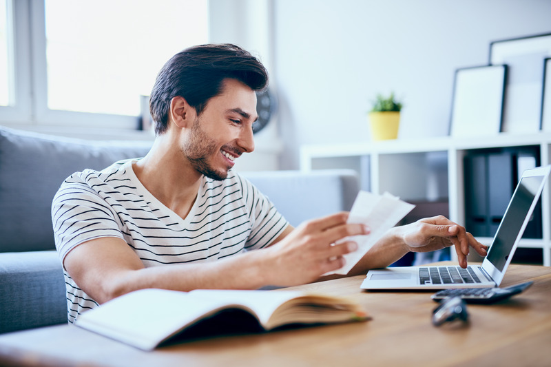 Patient checking their dental insurance for dental emergencies